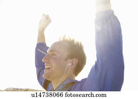 Sporty young man celebrating in the sun