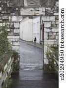 Woman walking through door frame