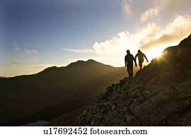 Men hiking on rocky mountainside