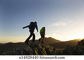 Men hiking on rocky mountainside