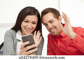 Business people using cell phone Business people using cell phone