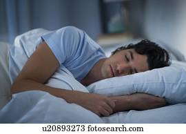 Man sleeping in bed