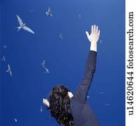 Businesswoman cheering outdoors