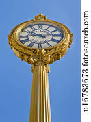 Antique clock against clear sky