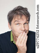 Studio portrait of mature man with facial expression