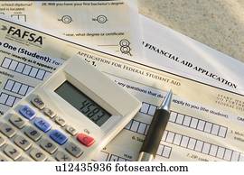 Studio shot of application form and calculator