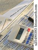 Studio shot of application form and calculator