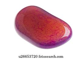 Cutout of a rhodonite gemstone on white background