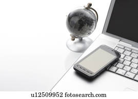 Globe and Smart Phone on Desk Globe and Smart Phone on Desk