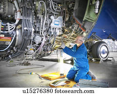 trabalhador, examinando, avião, maquinaria