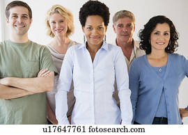 People in casual clothing posing for picture