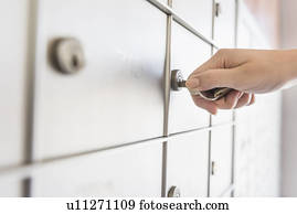 Woman opening safety deposit box