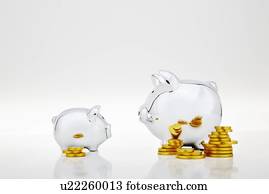 Stacks of gold coins by piggy banks