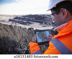 Ecologist examining surface coal mine