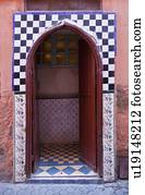 Ornate arched doorway with tiles
