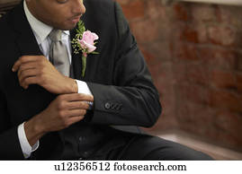 Bridegroom adjusting cuff