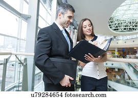 Businessman and woman discussing work