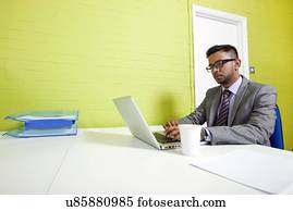 Indian businessman working at his desk