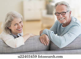 Senior couple sitting on sofa