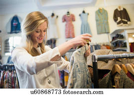 Woman looking at top garment