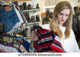 Woman looking at top garment