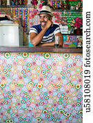 Man at counter of cafe bar