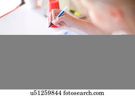 Young girl adding profit from goods