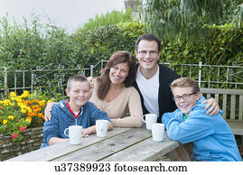 Family portrait at picnic bench Family portrait at picnic bench