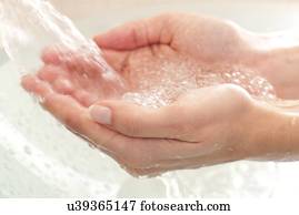 Woman washing her hands