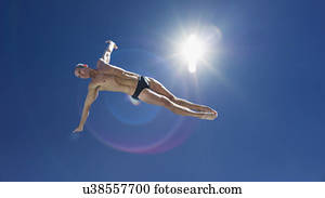 Athletic swimmer jumping