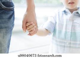 Mother and son holding hands Mother and son holding hands
