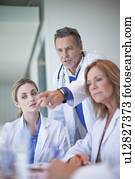 Group of doctors having a serious meeting in conference room