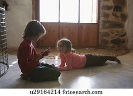 Brother And Sister Playing In Living Room Brother And Sister Playing In Living Room