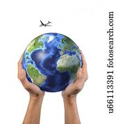 Hands holding globe with aeroplane