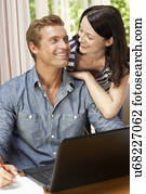 Couple Working In Home Office