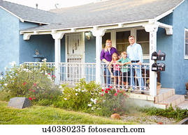 Picture of 1960S Family Of Four At Fence Of Suburban Home Outdoor Man