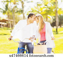 Couple riding on bikes