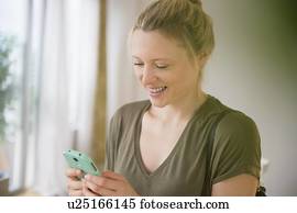 Woman texting on mobile phone