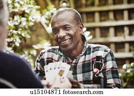 Senior men playing cards