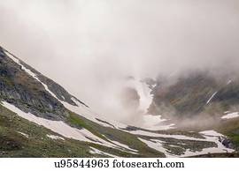 View of low cloud and snowy valley, Ural mountains, Russia