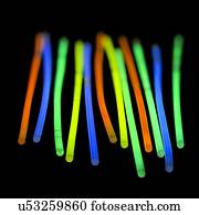 Glow sticks against a black background.