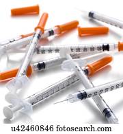 Syringes against a white background.