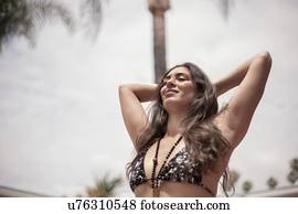 Young woman in bikini enjoying fresh air