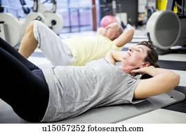 People exercising in gym