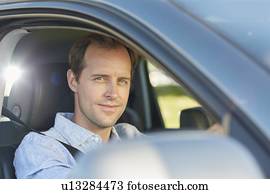Mid adult man in car