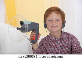 Boy playing with spy device