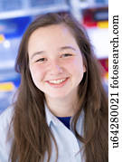 Portrait of girl with long brown hair, smiling