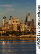 The skyscrapers of Philadelphia rise above the Delaware River at sunrise
