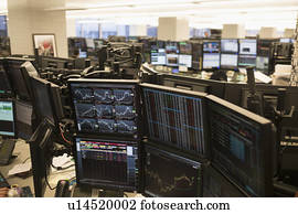 Trading floor with working computers