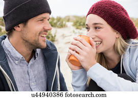 Young couple picnicking on beach, Western Cape, South Africa
